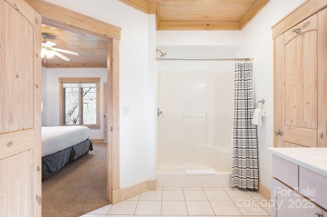 ensuite bathroom with ceiling fan, ensuite bathroom, tile patterned flooring, a shower with shower curtain, and wood ceiling