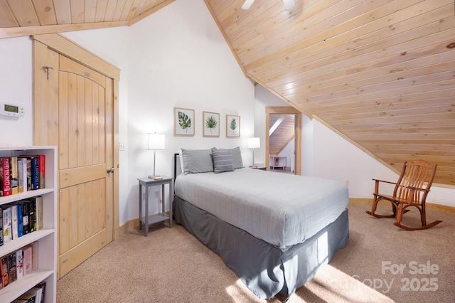 bedroom with carpet floors, wooden ceiling, baseboards, and vaulted ceiling