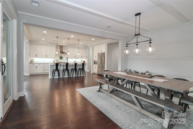 dining room featuring dark wood finished floors, visible vents, recessed lighting, and ornamental molding