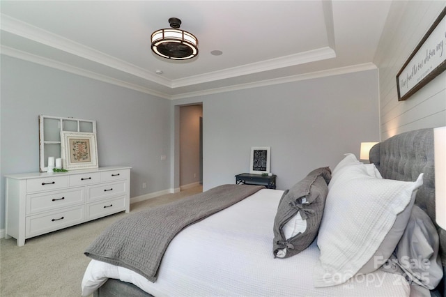 bedroom featuring light colored carpet, baseboards, and ornamental molding