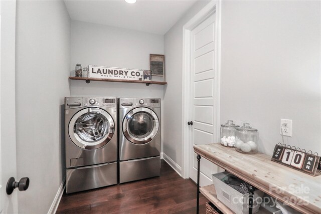 laundry room featuring dark wood-style floors, laundry area, independent washer and dryer, and baseboards