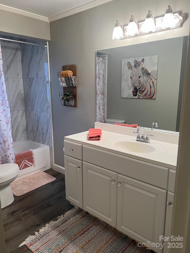 full bath featuring toilet, ornamental molding, shower / tub combo, vanity, and wood finished floors