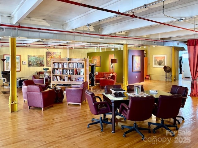 interior space with visible vents and wood finished floors