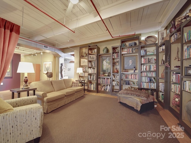 interior space featuring visible vents and wall of books