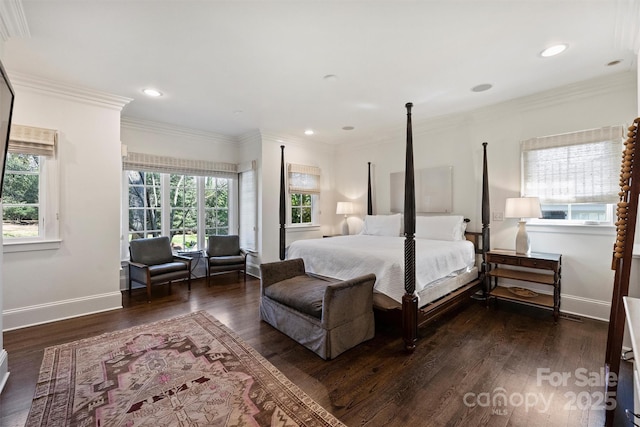 bedroom featuring ornamental molding, wood finished floors, and baseboards