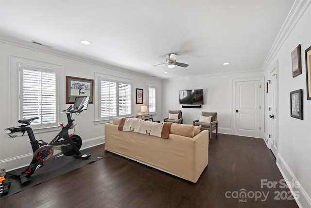 living room featuring ceiling fan, baseboards, dark wood-type flooring, and crown molding