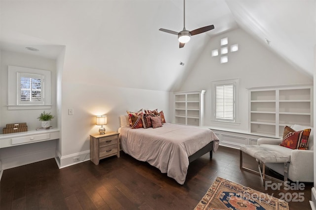 bedroom featuring dark wood-style floors, lofted ceiling, baseboards, and a ceiling fan