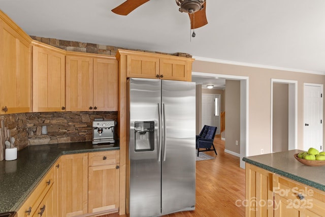 kitchen with light wood finished floors, decorative backsplash, a ceiling fan, ornamental molding, and stainless steel refrigerator with ice dispenser