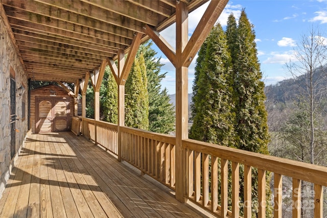 wooden deck featuring an outdoor structure