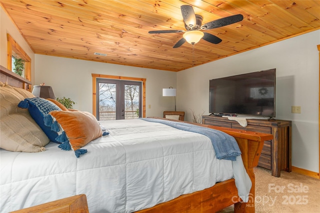 bedroom featuring french doors, carpet, wooden ceiling, and access to exterior