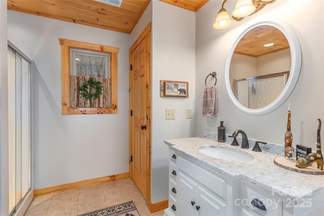 bathroom featuring a stall shower, vanity, wooden ceiling, baseboards, and tile patterned floors