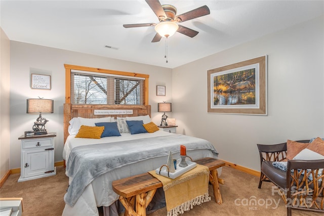 bedroom featuring ceiling fan, carpet floors, visible vents, and baseboards