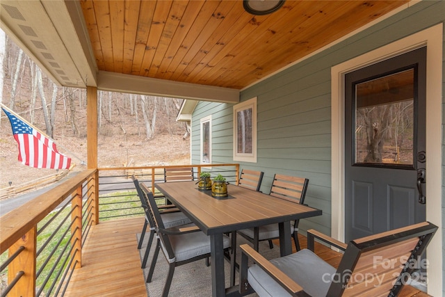 deck with outdoor dining space