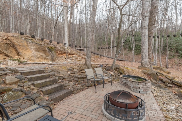 view of patio / terrace with an outdoor fire pit