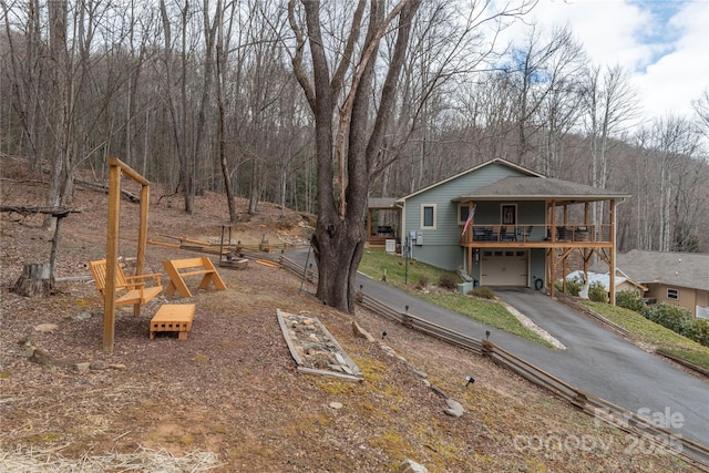 view of yard with driveway and an attached garage