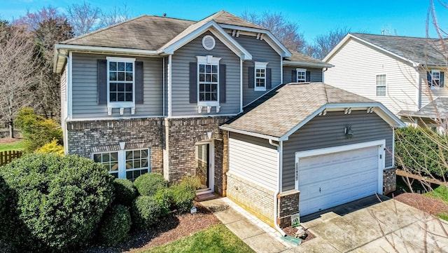 view of front of property with a garage, concrete driveway, and brick siding