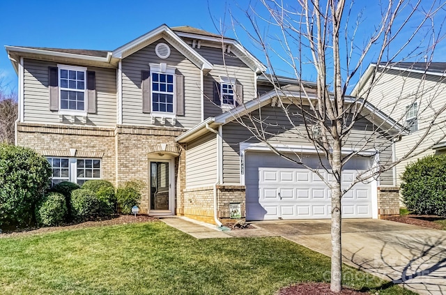 traditional home with concrete driveway, brick siding, an attached garage, and a front lawn