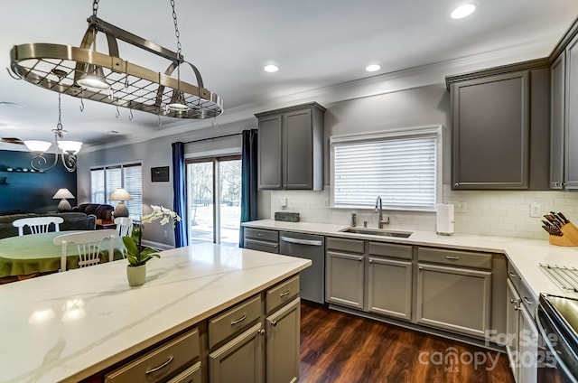 kitchen featuring a sink, open floor plan, ornamental molding, stainless steel dishwasher, and dark wood-style floors