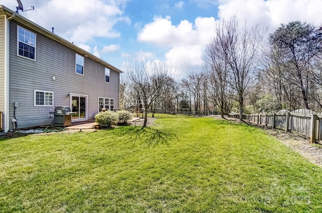 view of yard with a fenced backyard