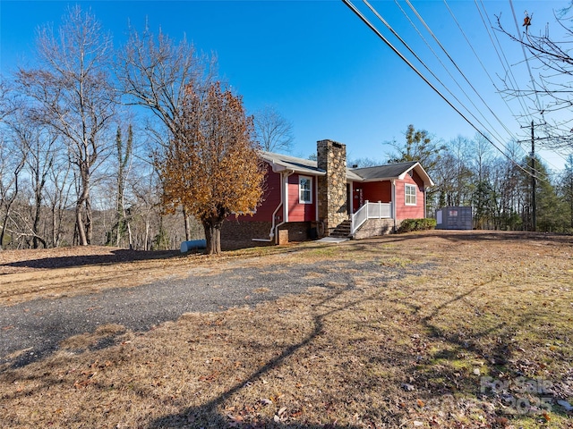 view of front of home featuring a chimney