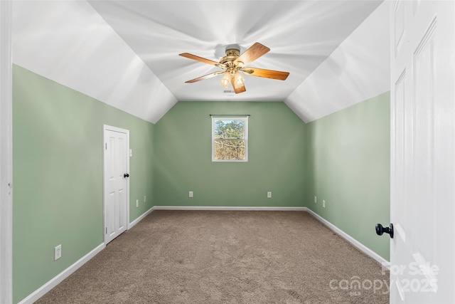 bonus room featuring carpet floors, ceiling fan, baseboards, and lofted ceiling