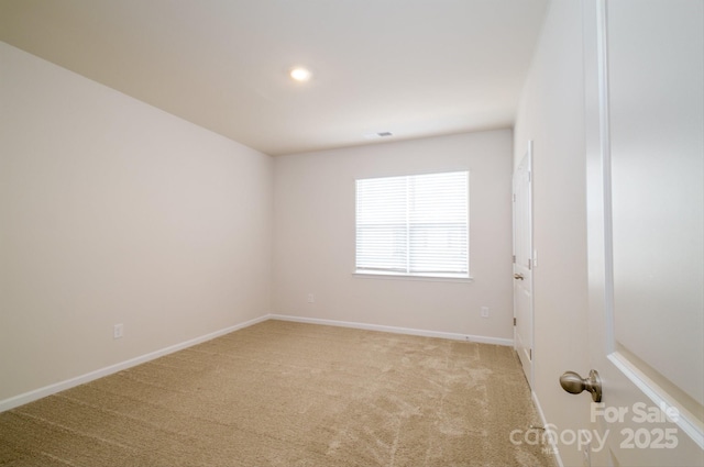 carpeted spare room with recessed lighting and baseboards