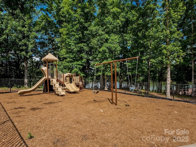 community jungle gym featuring fence