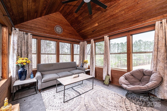 carpeted living area with vaulted ceiling, wood ceiling, wood walls, and ceiling fan