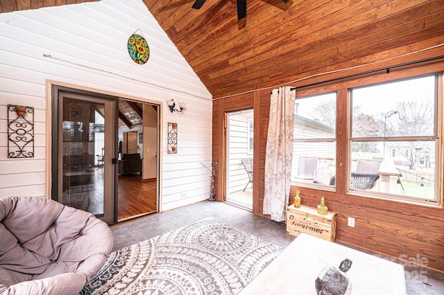 sunroom / solarium featuring wood ceiling, ceiling fan, and vaulted ceiling