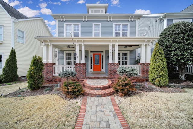 italianate-style house featuring ceiling fan and a porch