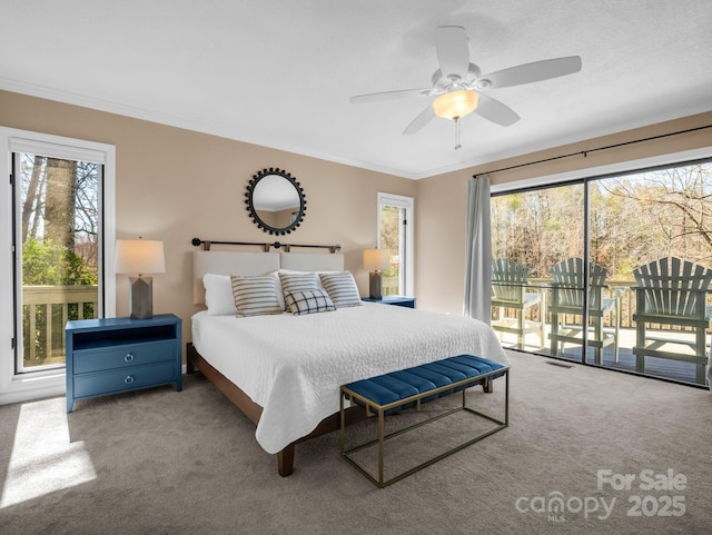 bedroom featuring access to exterior, crown molding, carpet, and visible vents