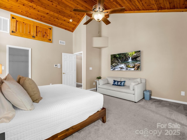 carpeted bedroom with visible vents, baseboards, wood ceiling, and ceiling fan