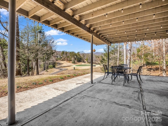 view of patio featuring outdoor dining area