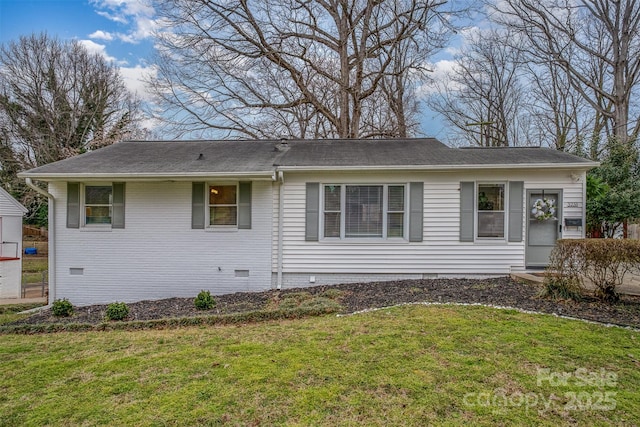 ranch-style home with crawl space, brick siding, and a front lawn