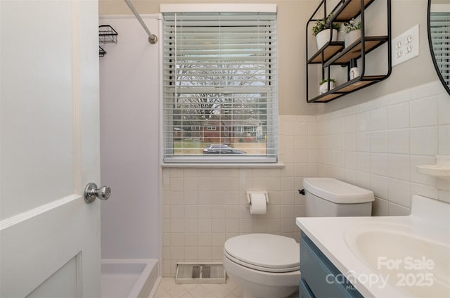 full bathroom featuring tile walls, toilet, a shower, and visible vents