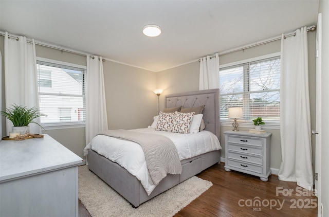 bedroom featuring dark wood-type flooring