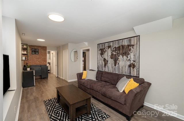 living room with wood finished floors and baseboards