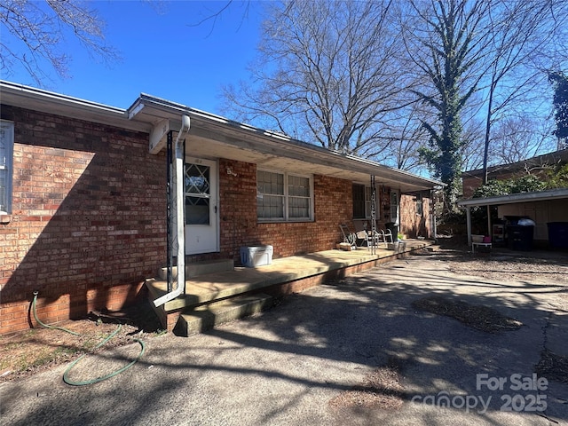 view of front of house with brick siding