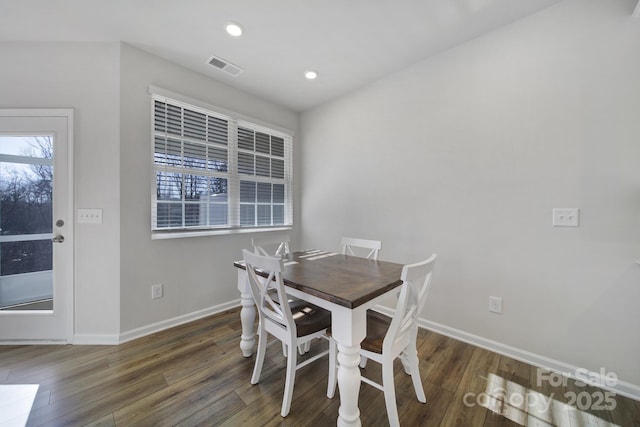 dining room featuring visible vents, recessed lighting, baseboards, and wood finished floors