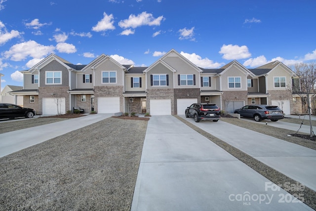 view of front facade with a garage, a residential view, and driveway