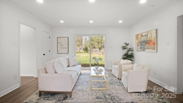 living area with ornamental molding, recessed lighting, baseboards, and wood finished floors