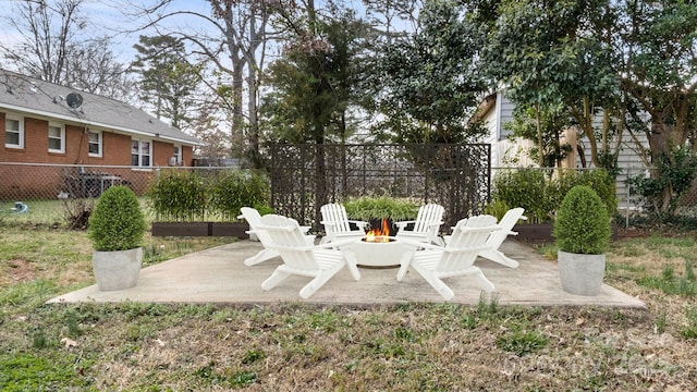 view of patio featuring a fire pit and fence