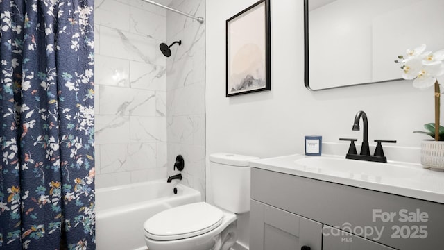 full bathroom featuring shower / tub combo with curtain, vanity, and toilet