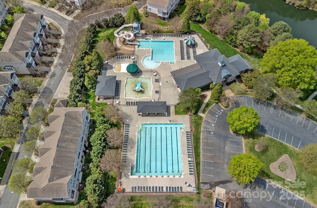 birds eye view of property with a water view
