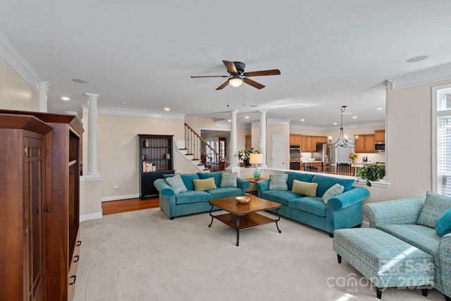 living area featuring decorative columns, stairs, a ceiling fan, and recessed lighting