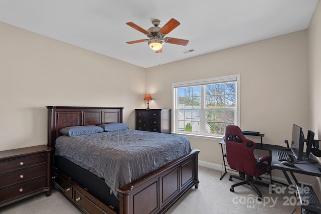 bedroom featuring light carpet, ceiling fan, baseboards, and visible vents