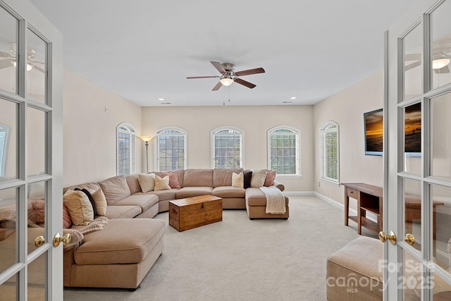 carpeted living area with recessed lighting, french doors, baseboards, and ceiling fan