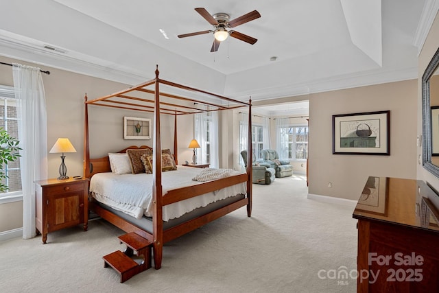 carpeted bedroom with visible vents, baseboards, and a ceiling fan