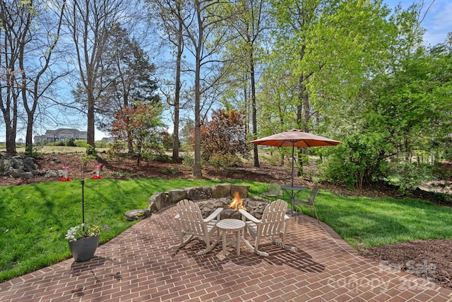 view of patio / terrace with an outdoor fire pit