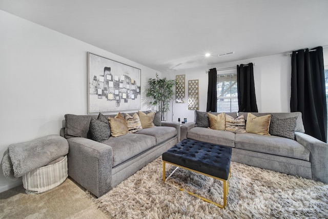 carpeted living room with visible vents